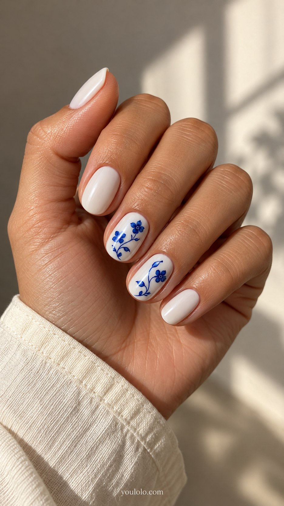 Cobalt Tea-Cup Florals: short oval creamy white nails, delicate flat cobalt blue tiny flowers and curling stems on two accents