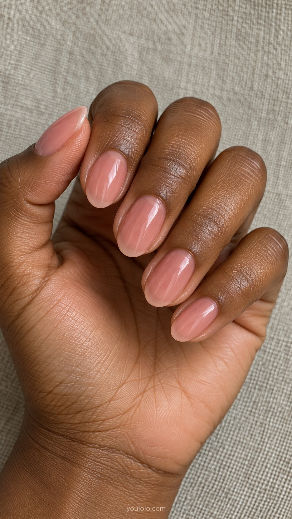 Short Almond Nail Designs: Rosewater Glass manicure on a naturally posed hand