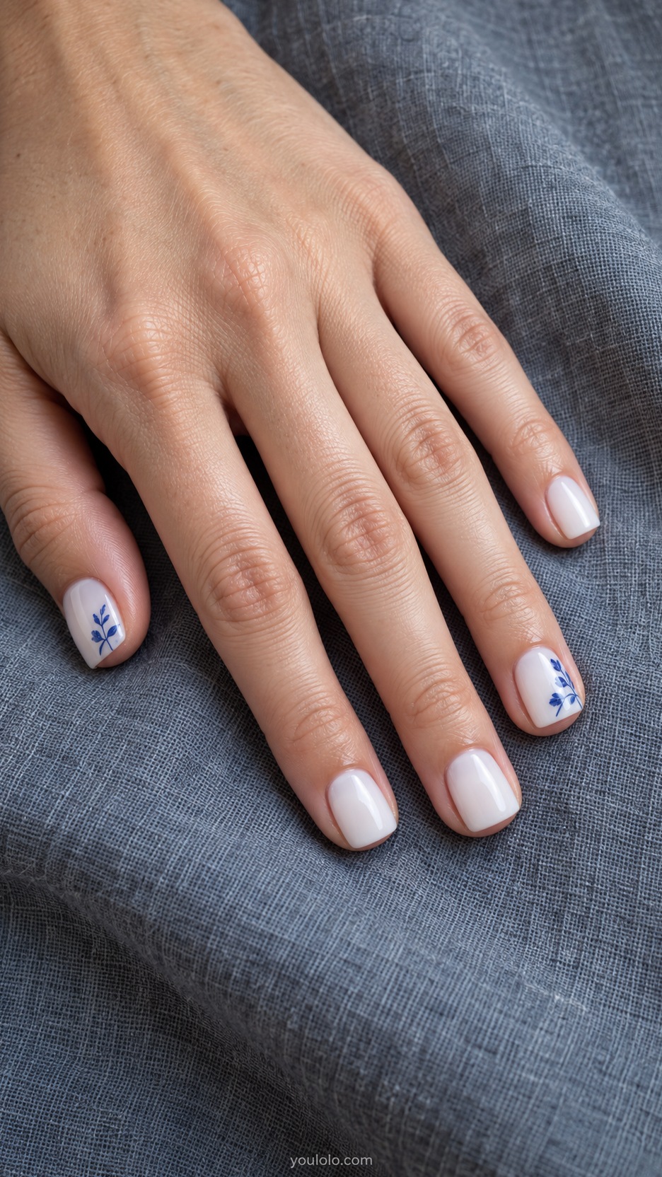 Short Square Nail Designs: Porcelain Blue Corners manicure on a naturally posed hand