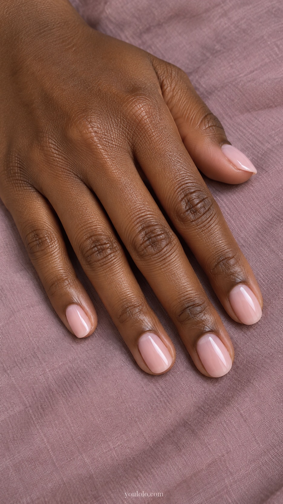 Short Wedding Nails: Sheer Bridal Blush manicure on a naturally posed hand