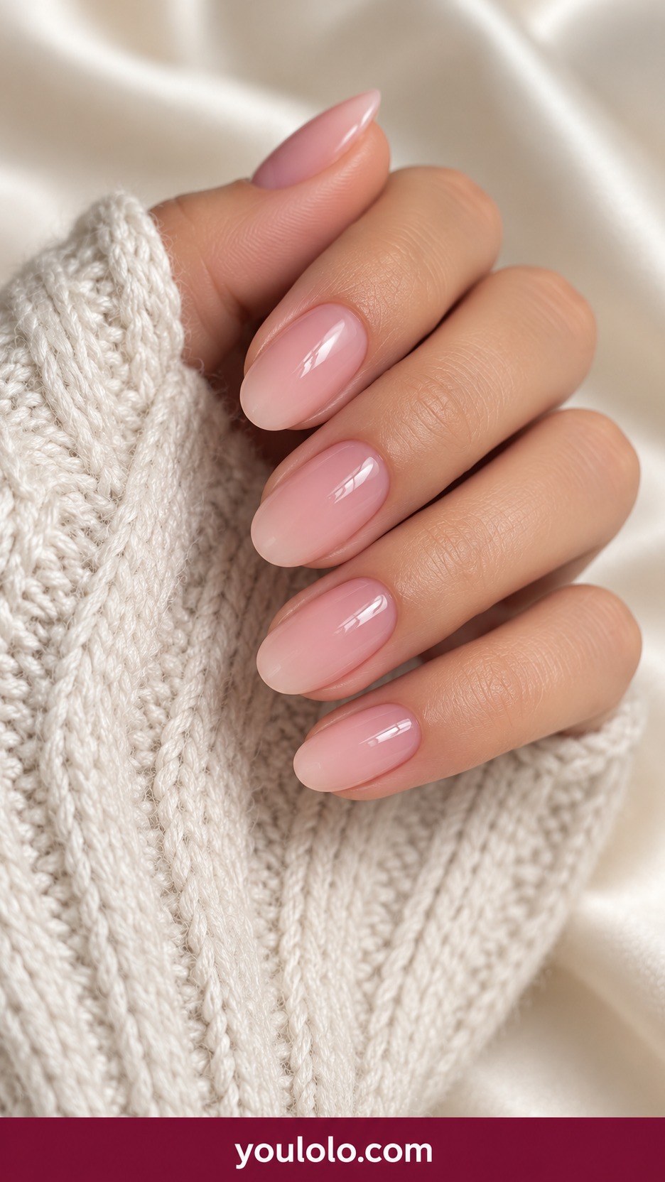 Short oval nails sheer rosy pink glossy evenly translucent no decorations on a naturally curled young adult hand