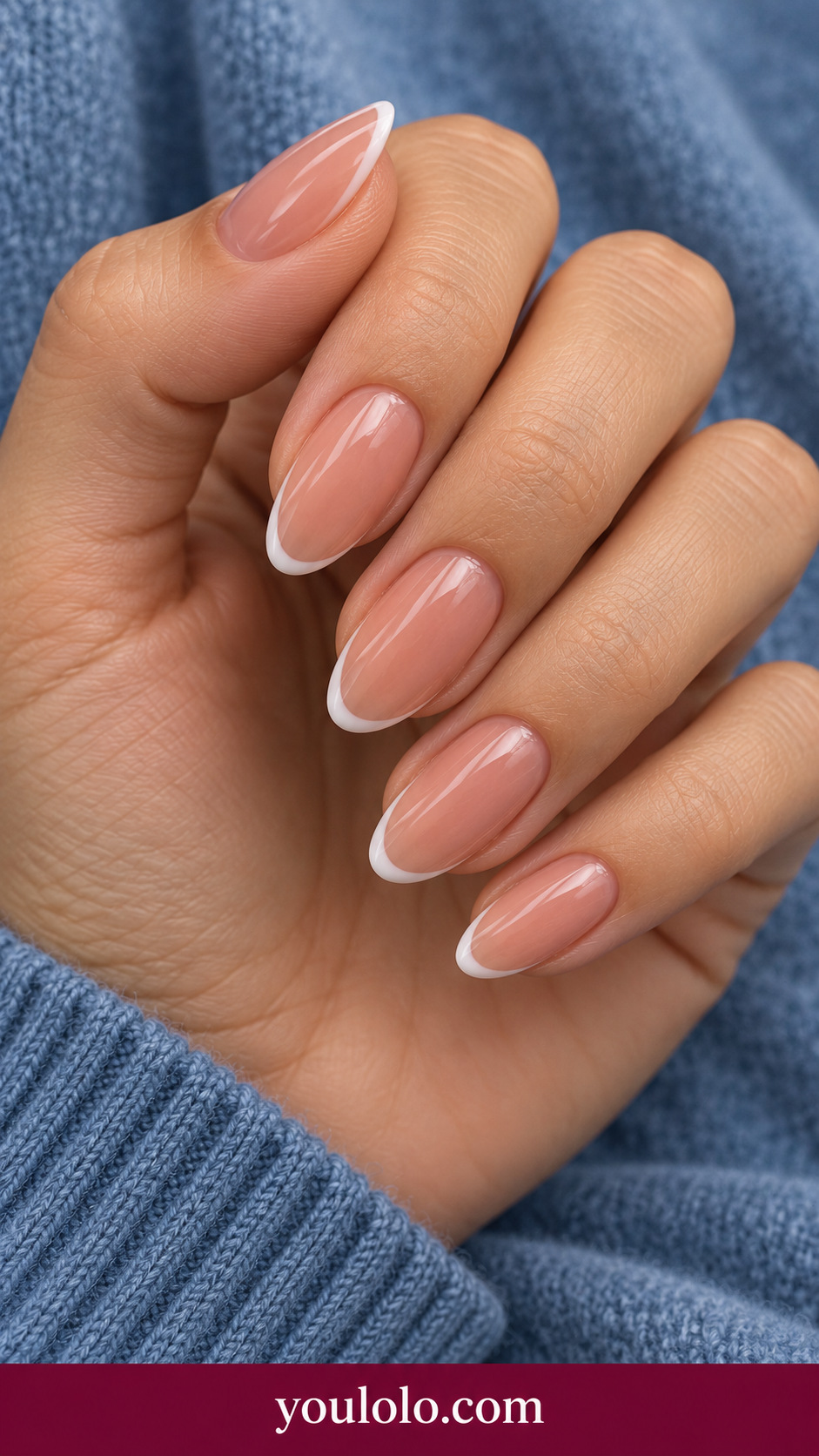 medium oval sheer rosy nude press-on nails with extremely thin white French tips, glossy no other art on a naturally posed adult female hand