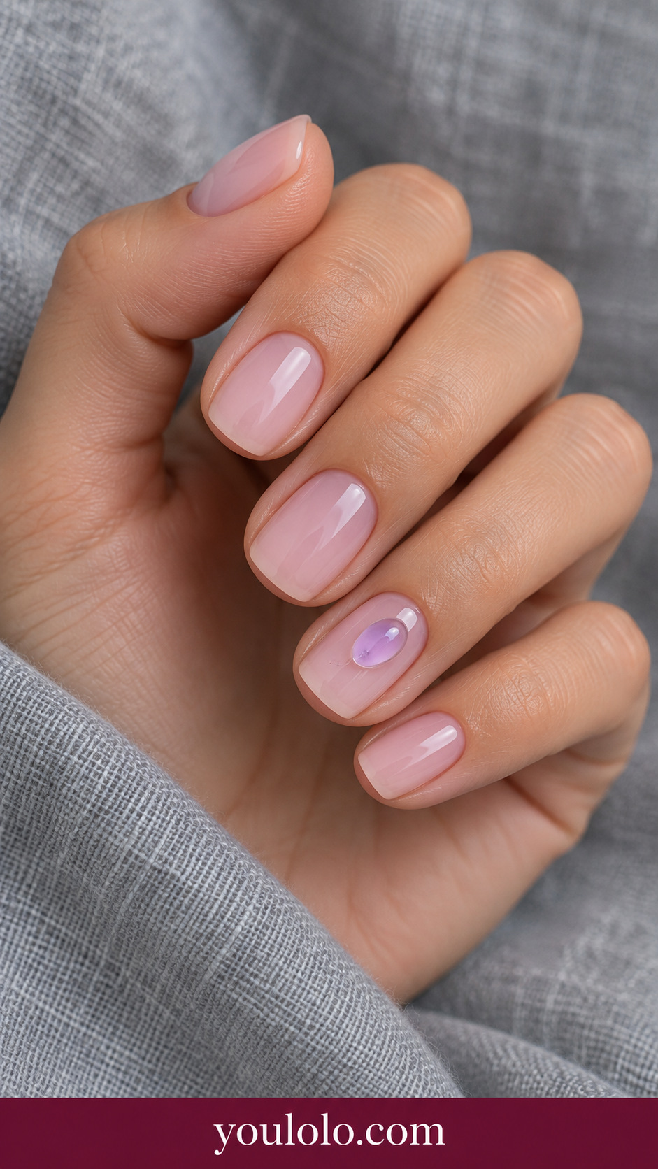 Clear Lavender Pocket: short squoval translucent pink nails one accent small clear low relief gel pocket with lavender tint inset on a naturally posed adult hand