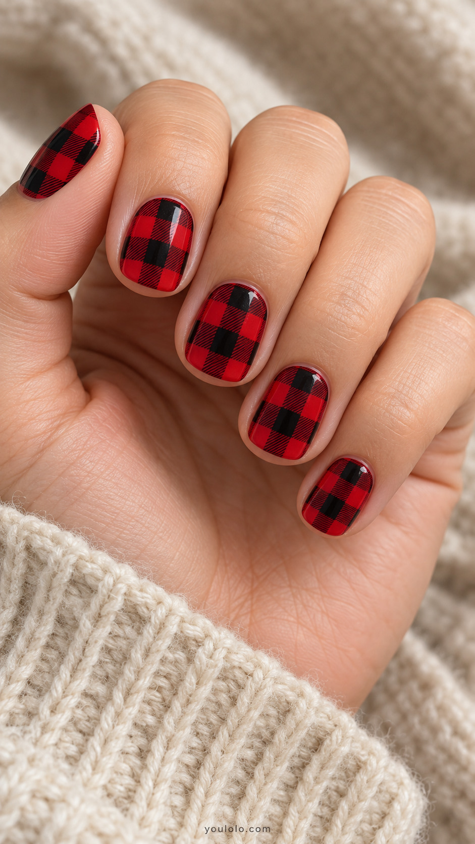 Short squoval nails with glossy red-and-black buffalo checks and fine woven hatching