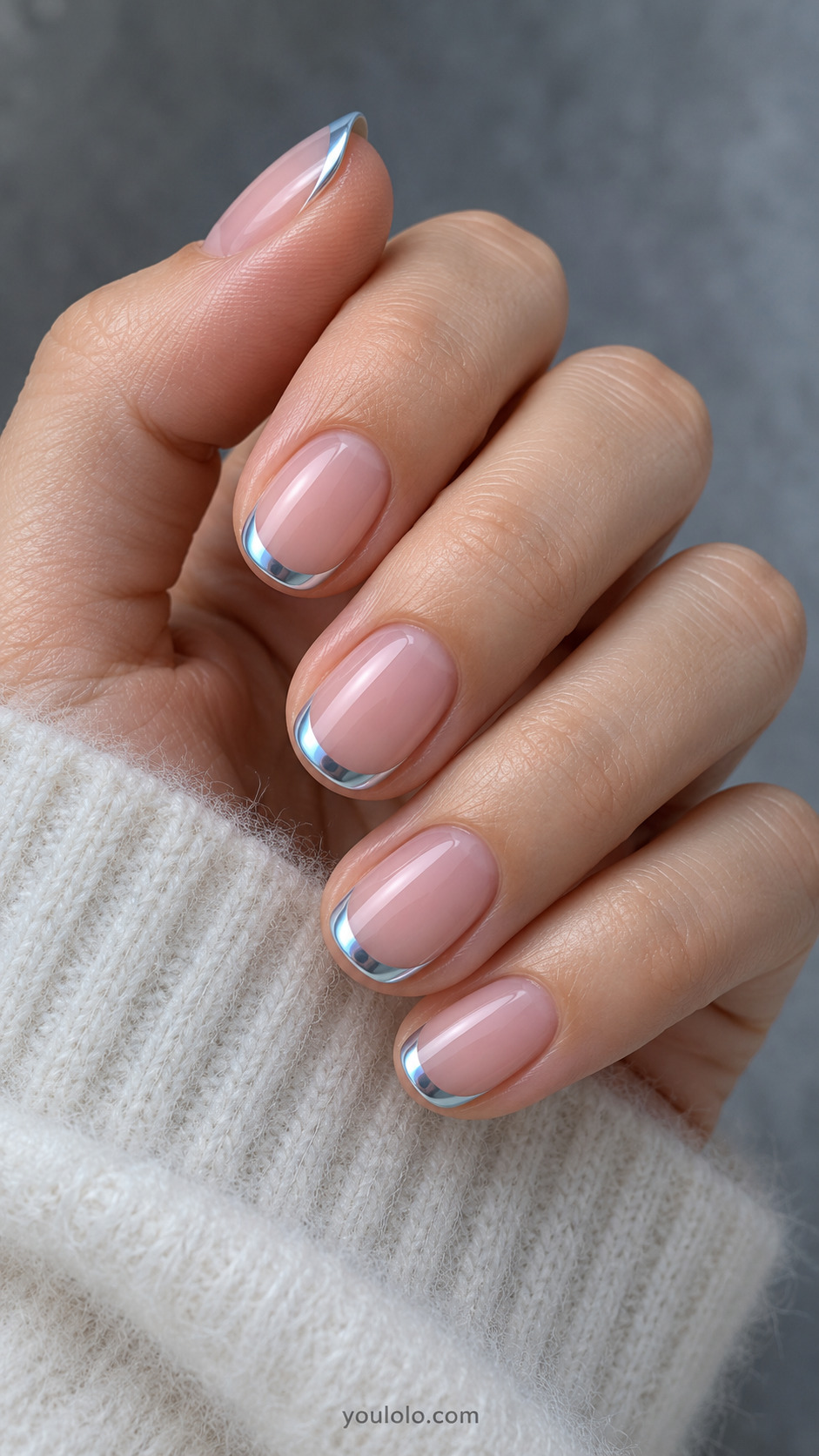 Sheer pink base, short oval shape, and a narrow icy-blue chrome smile line.