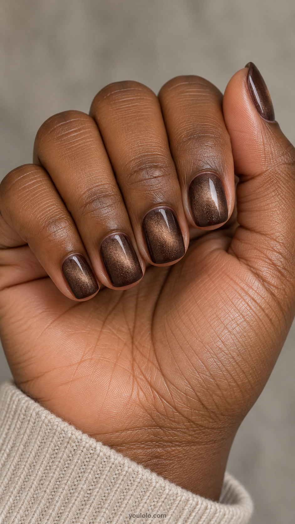 Short squoval nails: mocha brown magnetic polish with a broad diffuse velvet shimmer across whole nail, darker edges, no art.