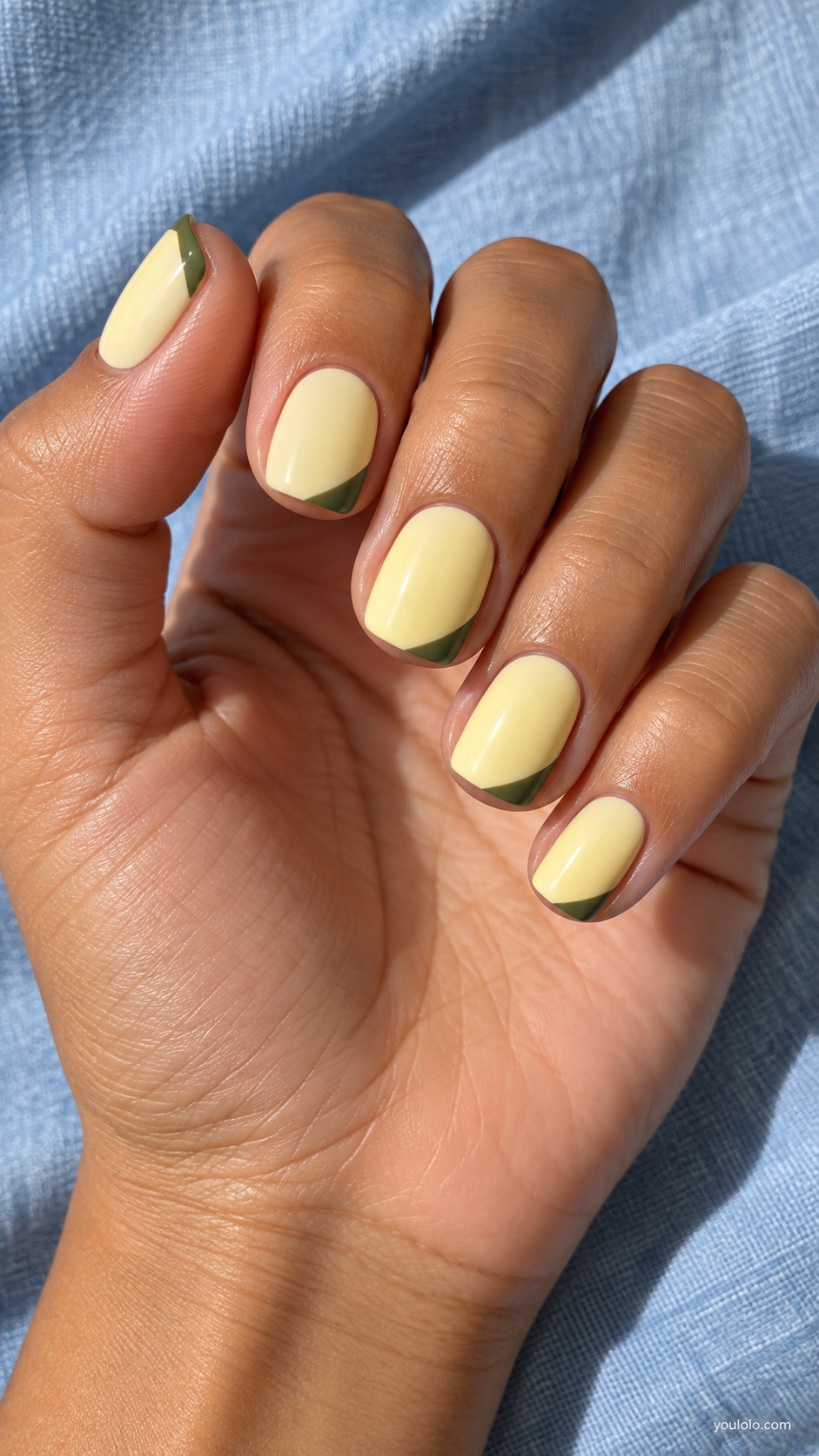Short squoval nails butter yellow cream with slim olive green diagonal tip corners