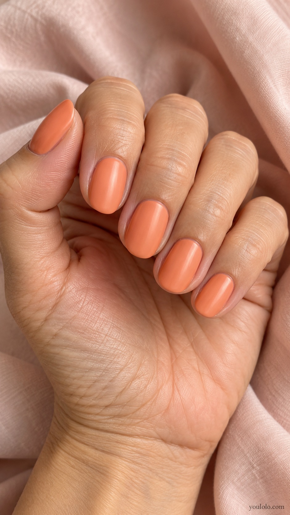 Medium rounded nails muted apricot orange satin finish