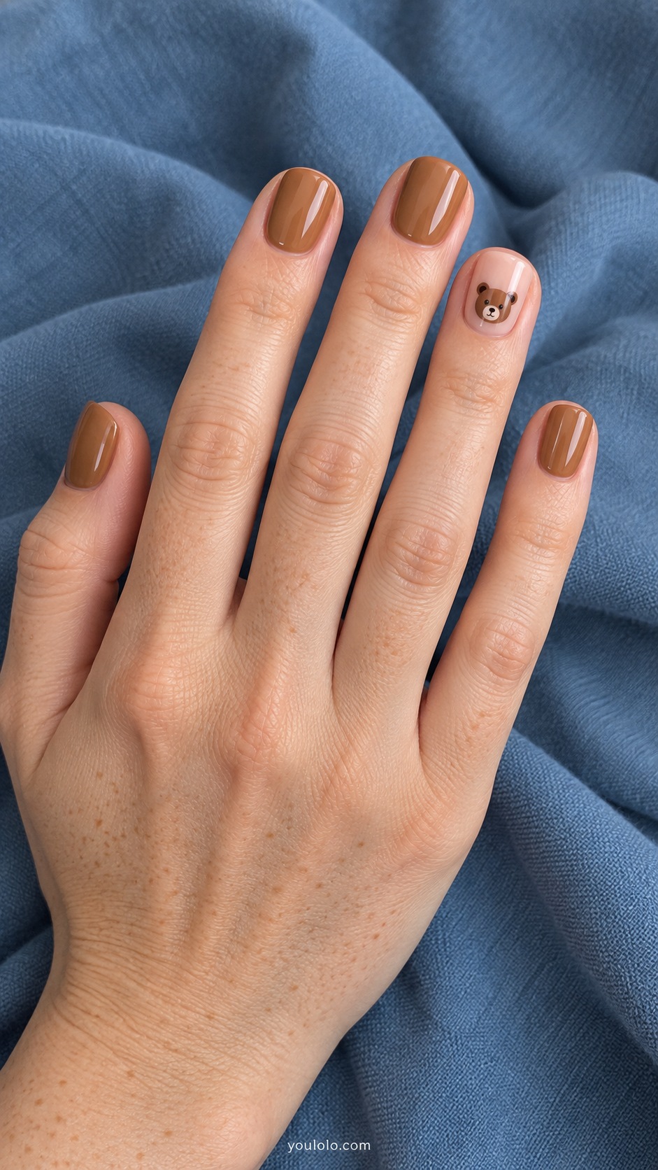 Short squoval nails creamy caramel four nails ring nude with tiny flat brown teddy bear face