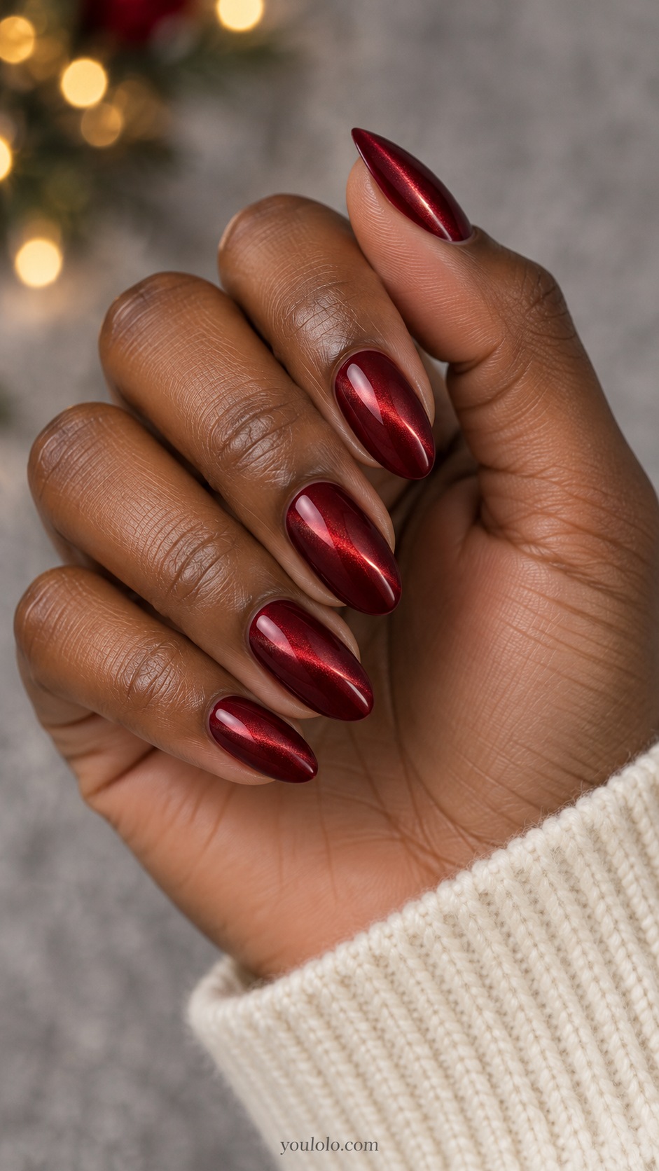 Medium almond dark ruby red magnetic nails narrow bright diagonal red light stripe