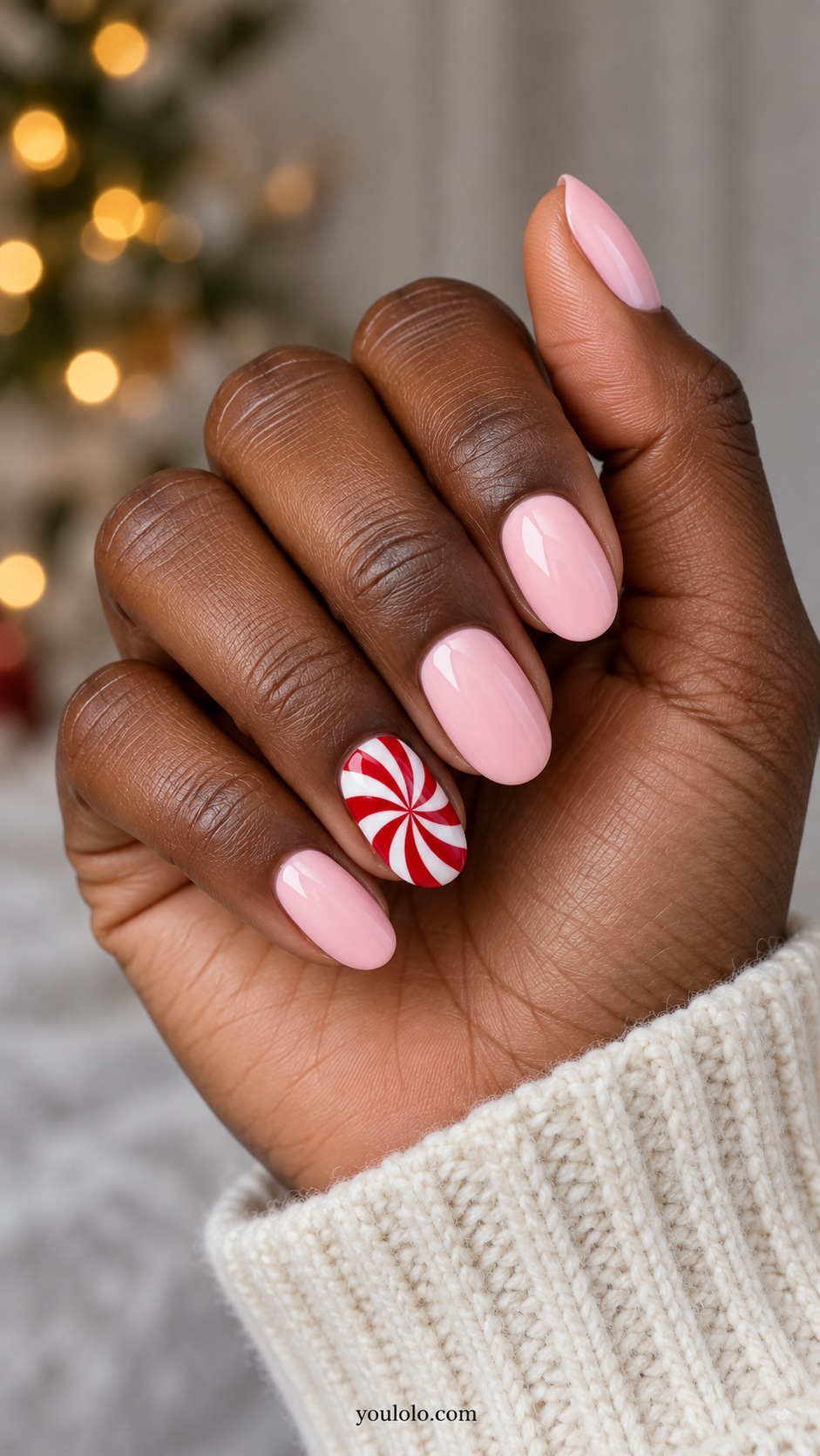 Medium oval pastel pink nails one ring nail flat red and white radial peppermint swirl