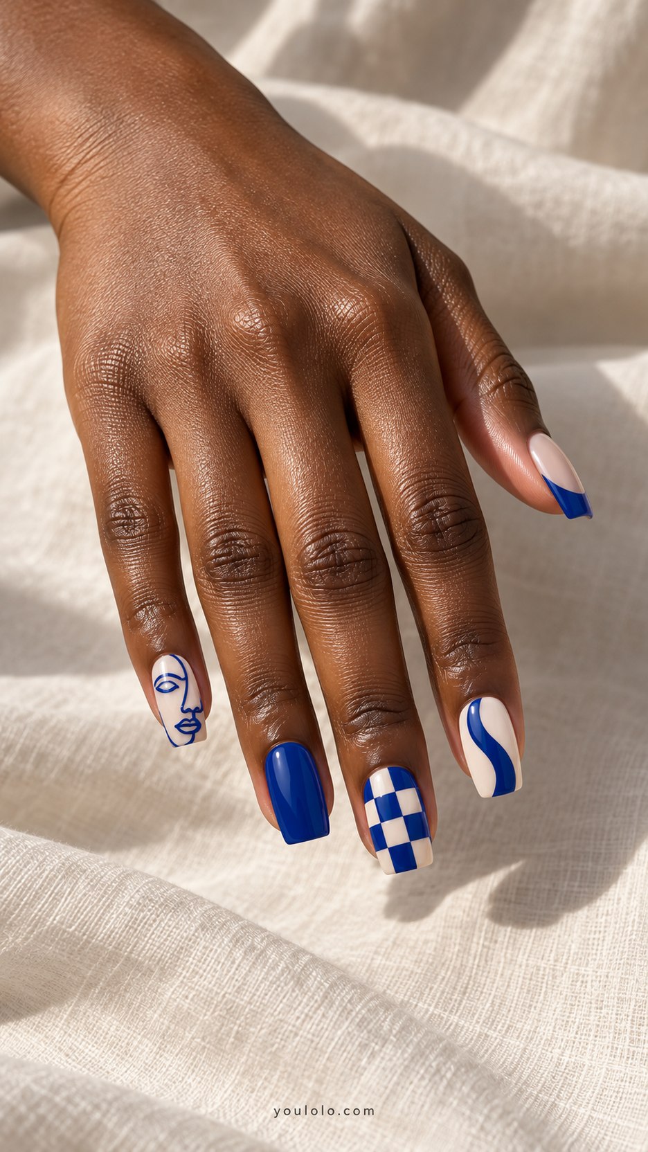 Cobalt Gallery Mix: medium square nails, cobalt and ivory: abstract face line, bold stripe, solid blue, checker accent, cobalt French tip