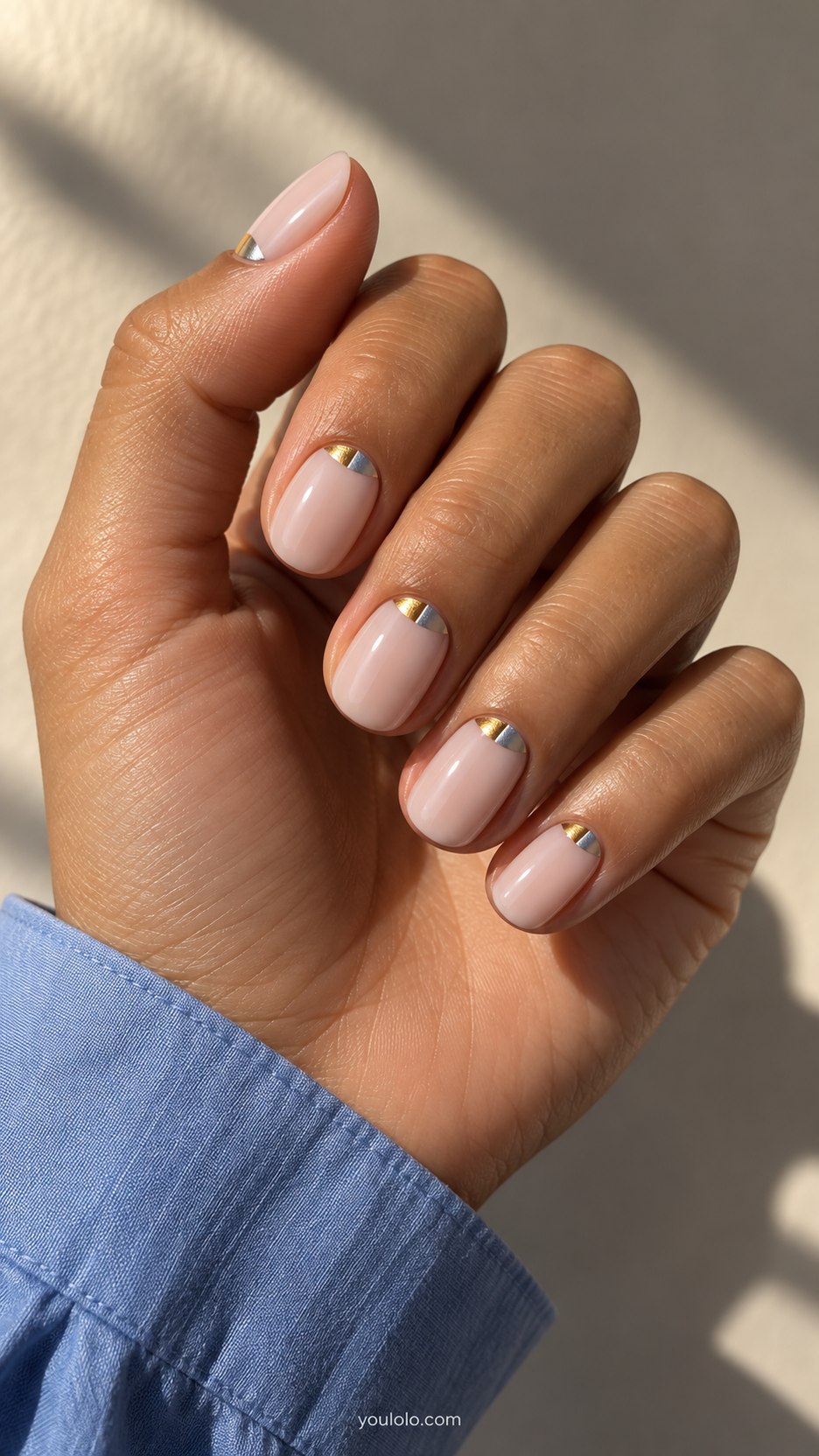 Split Metal Half Moons: short oval milky pink nails, tiny half-moon divided into gold and silver at base