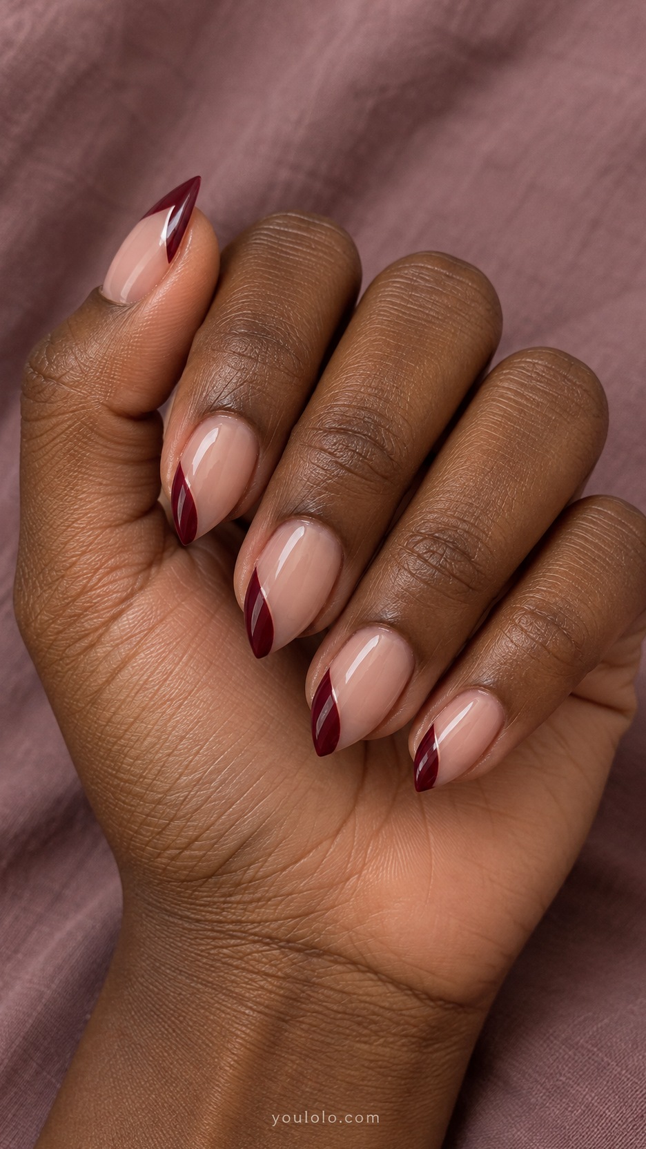 Short Stiletto French Nails: Wine Side French manicure on a naturally posed hand