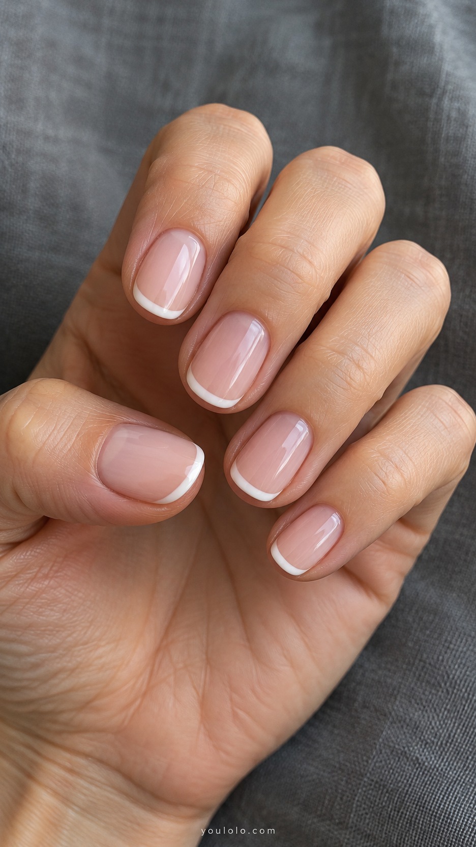 Short Wedding Nails: Ivory Micro French manicure on a naturally posed hand