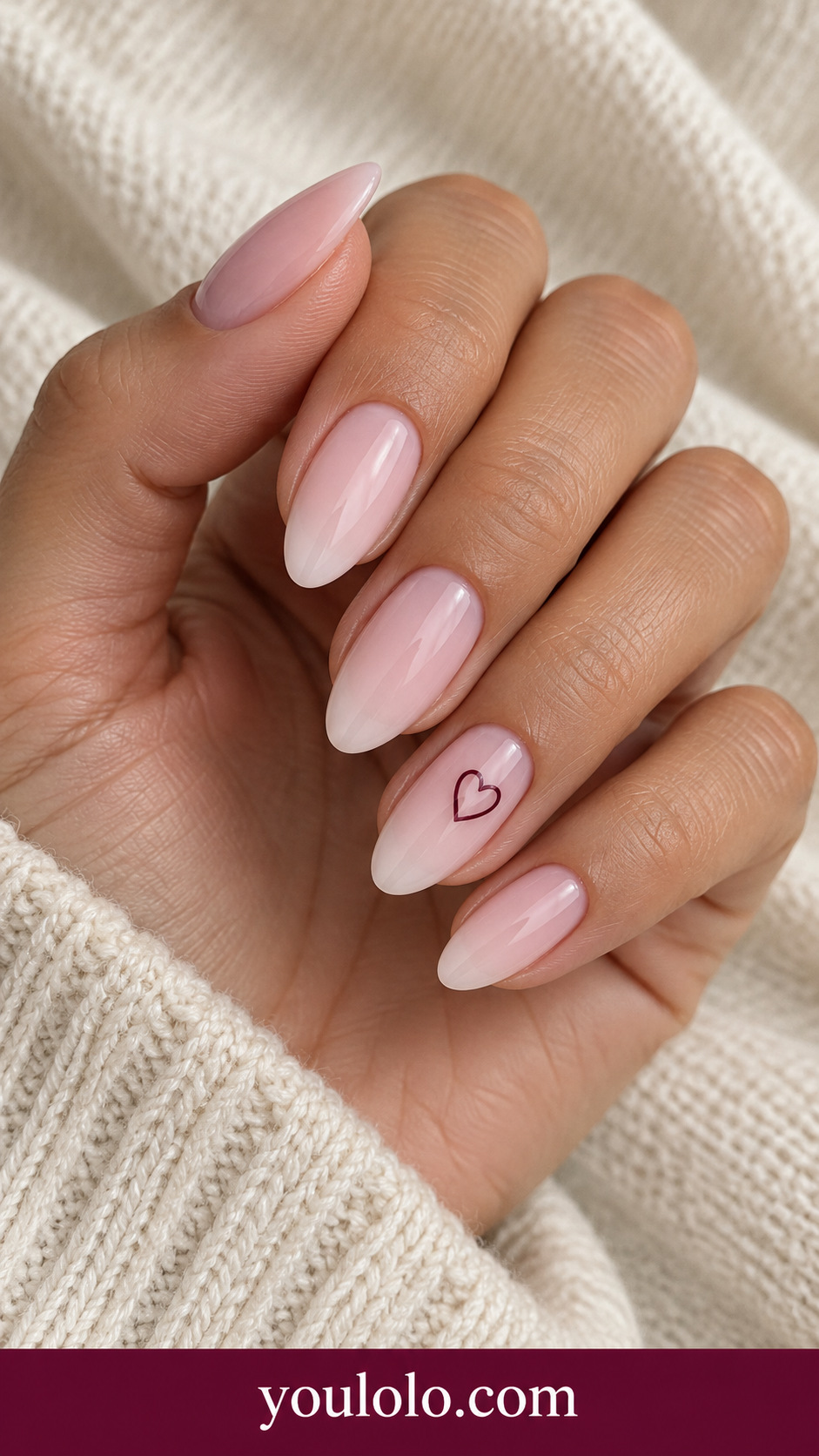 Open Burgundy Heart: medium almond milky blush nails one fine burgundy open heart outline on ring nail only on a naturally posed adult hand
