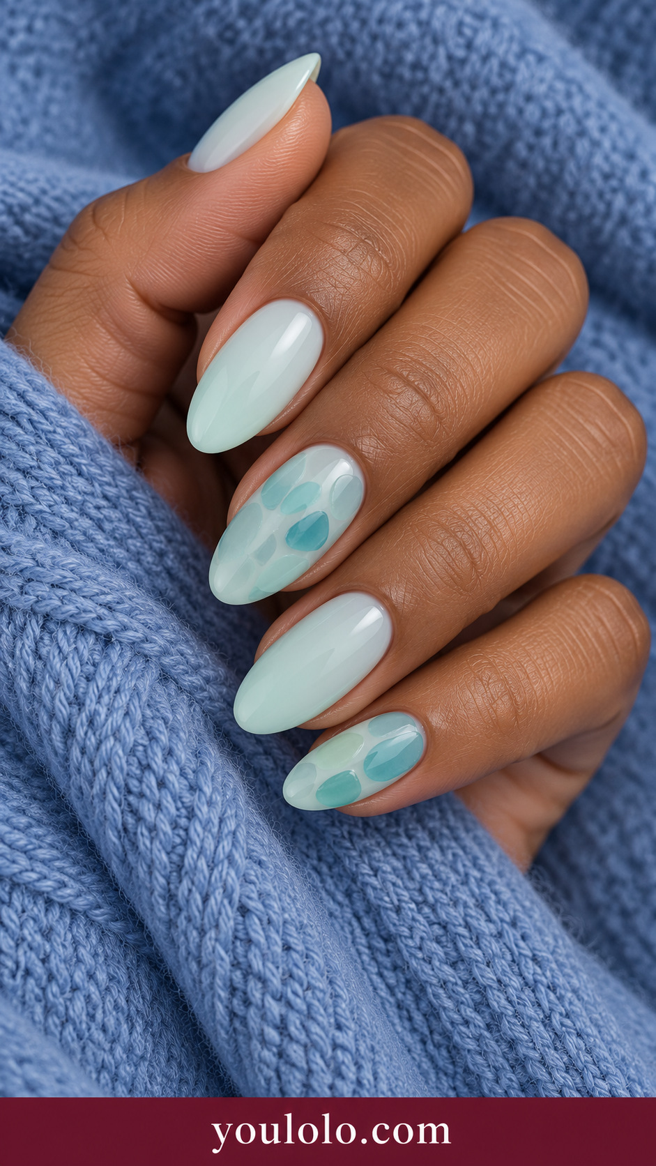 Sea Glass Mosaic: medium almond translucent pale mint nails two accents irregular flat seafoam and aqua glass-like mosaic patches, no foil on a naturally posed adult hand