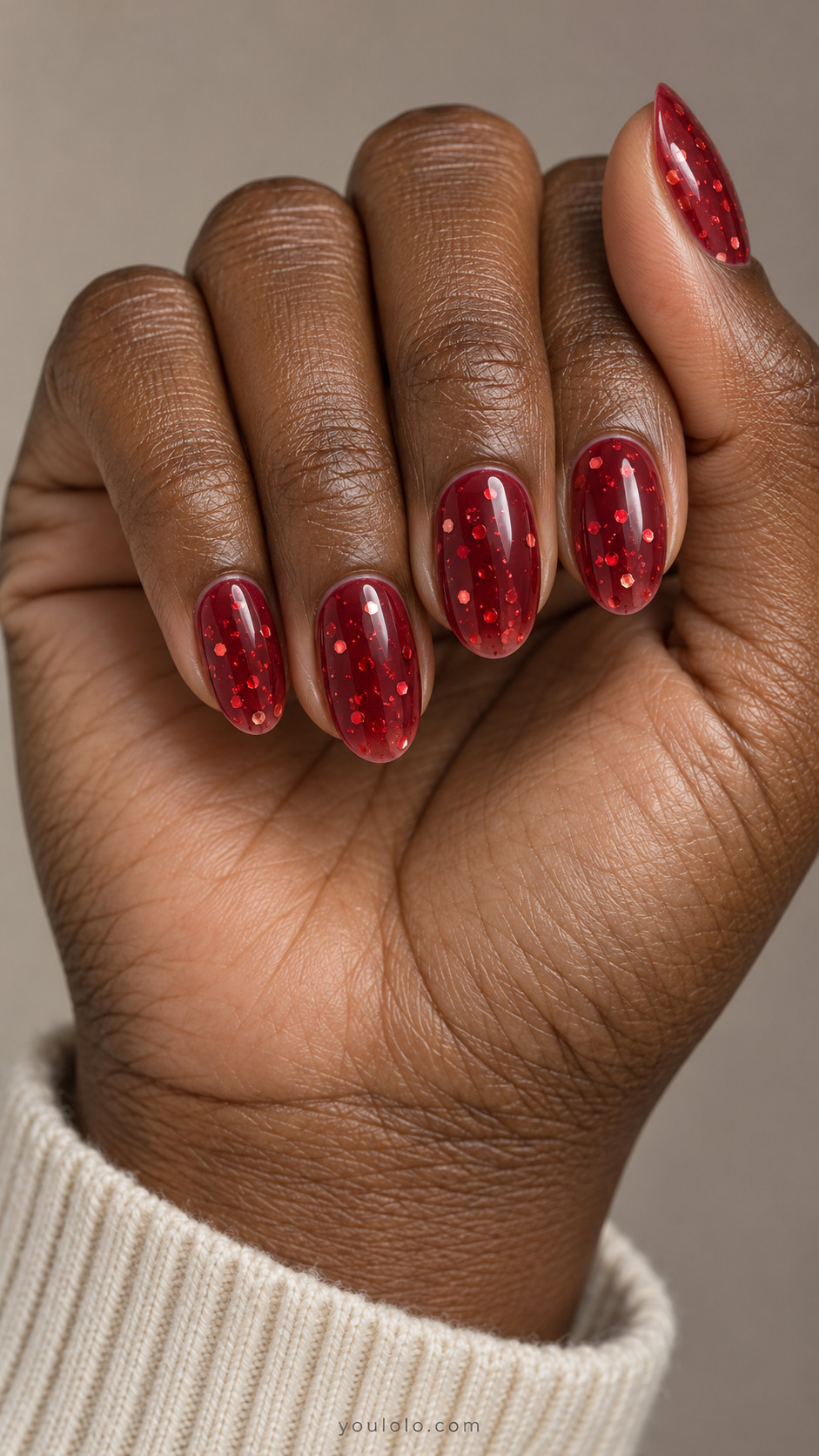 Cherry jelly oval nails with scattered red hexagonal glitter
