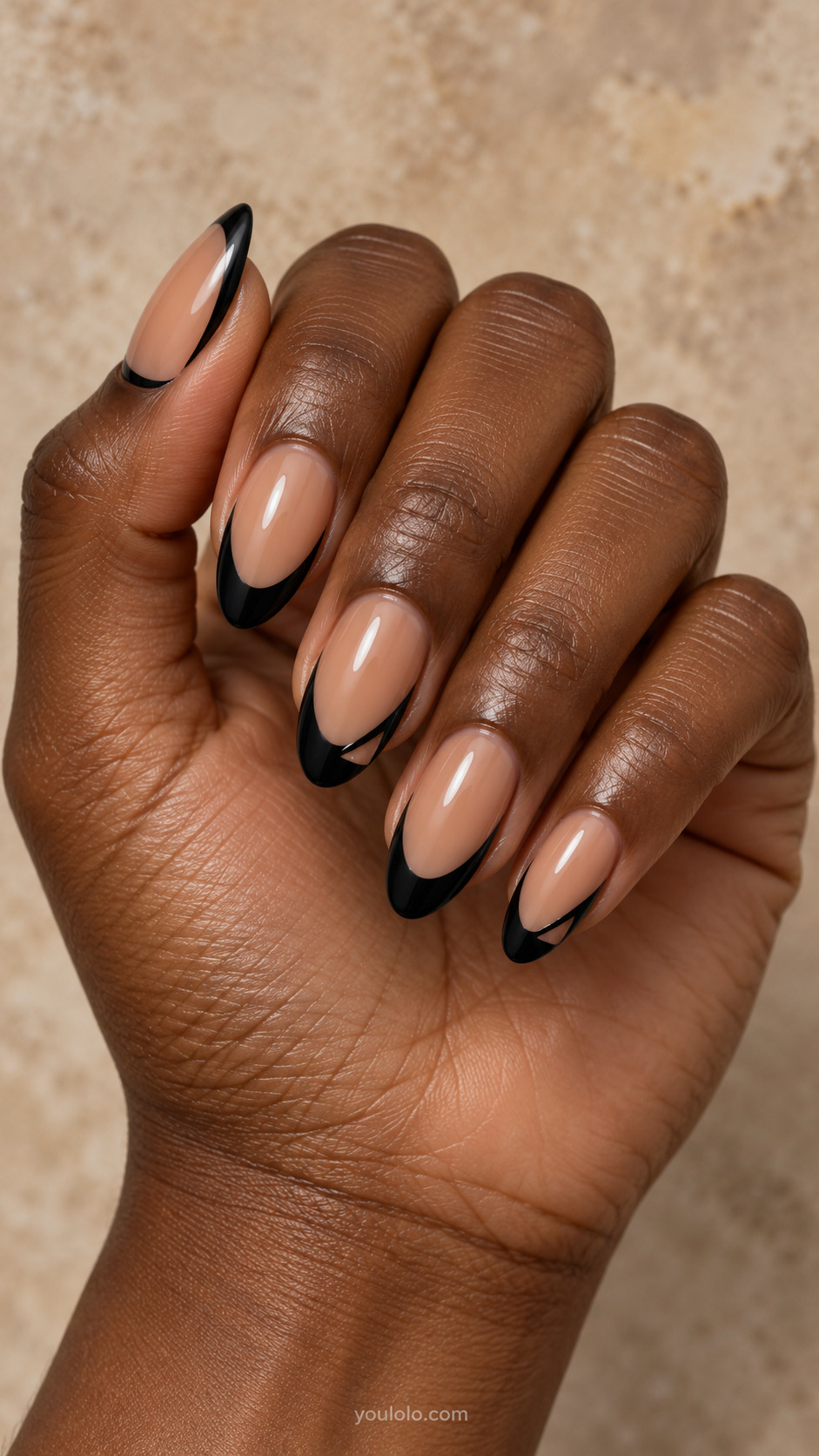 Open Oval Window Tips on almond nails with a nude base