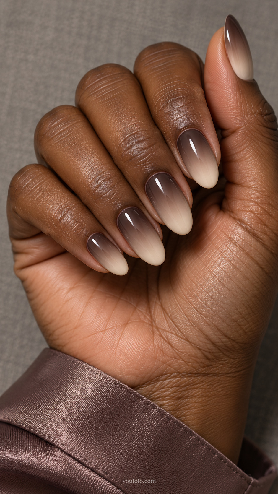 Espresso cuticles fading through taupe to creamy almond tips