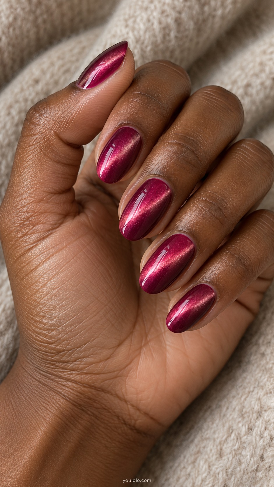 Raspberry Pink with a Diagonal Beam cat eye nails — Medium oval raspberry pink with a narrow luminous diagonal cat eye beam on every nail, dark berry edges.