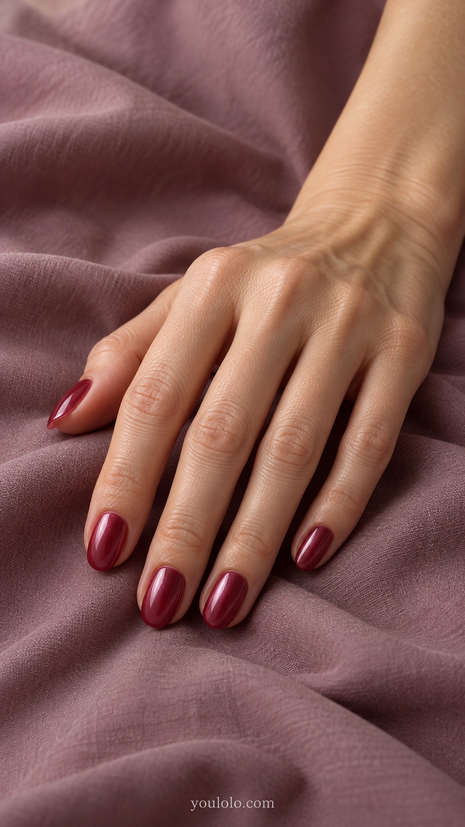 Short oval translucent wine red jelly under fine pink pearl sheen