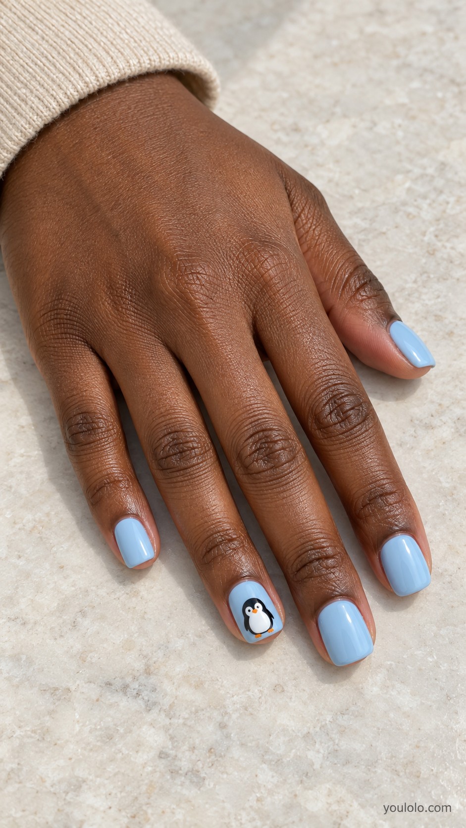 Christmas nail ideas — Icy Blue with a Tiny Penguin