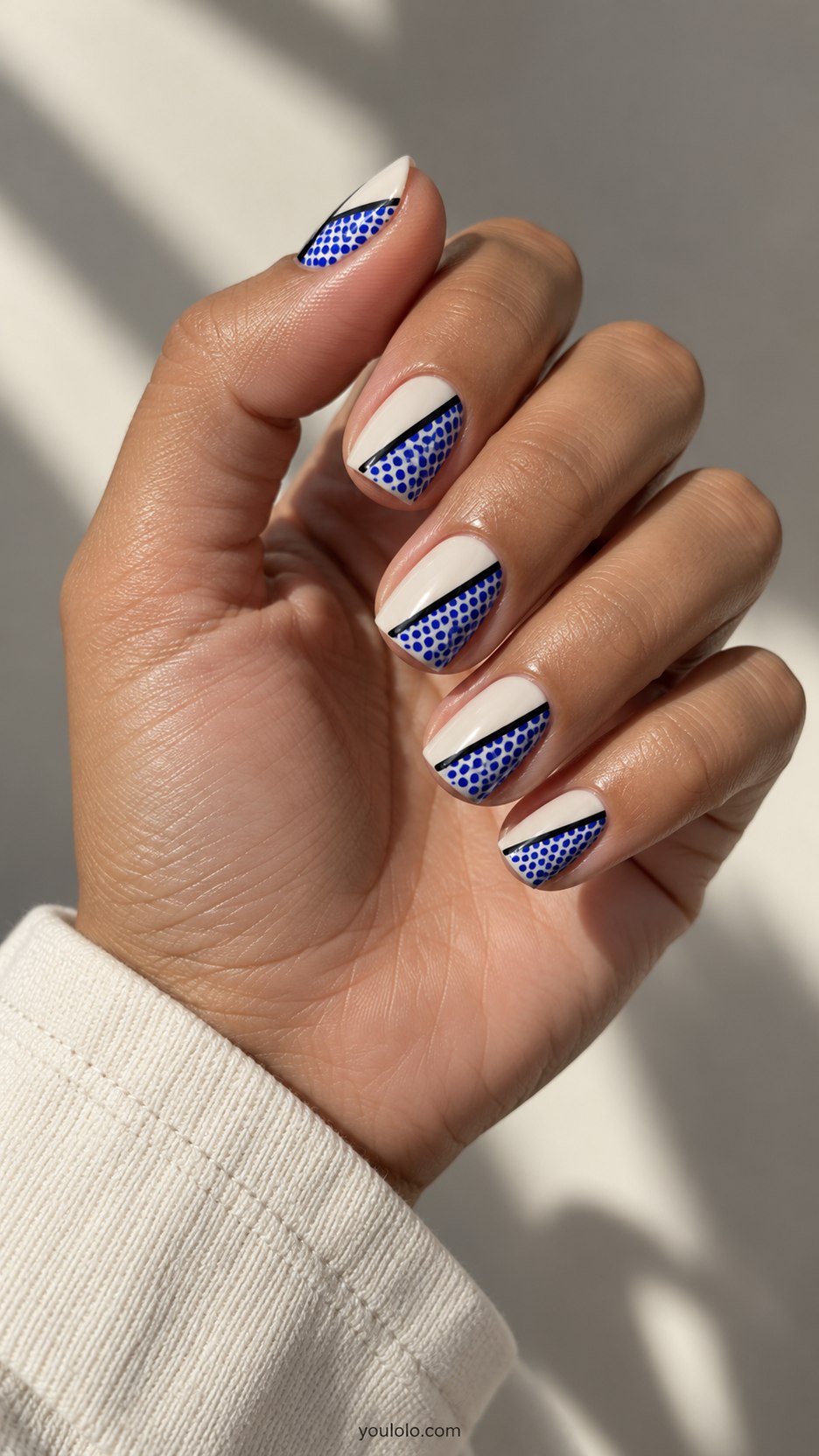 Cobalt Halftone Panels: short square cream nails, cobalt halftone dot panel and crisp black angular divider