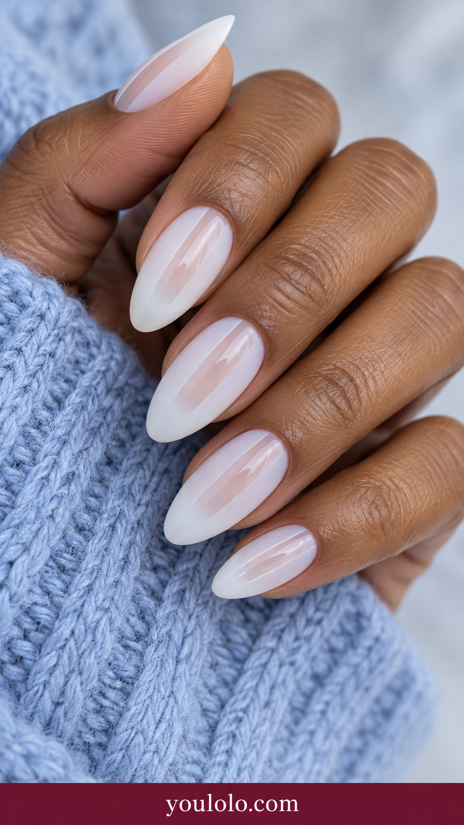 medium almond sheer translucent white nails with matte frosted side borders and narrow clear glossy center window on a naturally relaxed adult hand