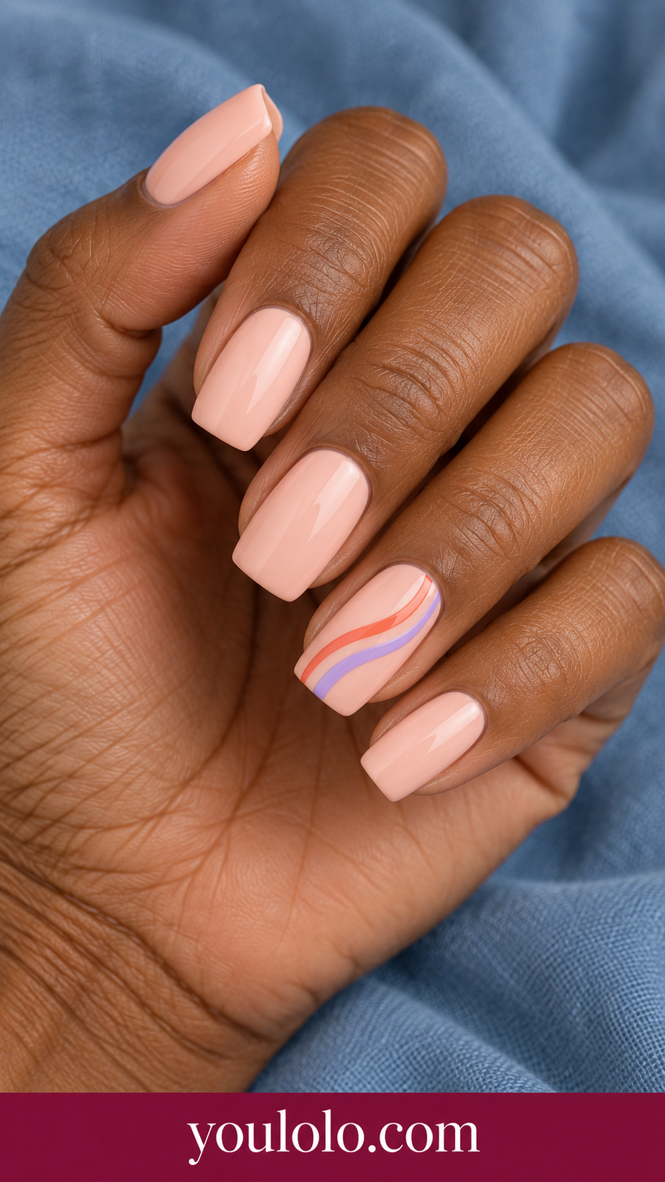 Sunset Stripe Stack: medium soft square pale peach nails one accent three fine curved stripes coral orange and lavender on a naturally posed adult hand