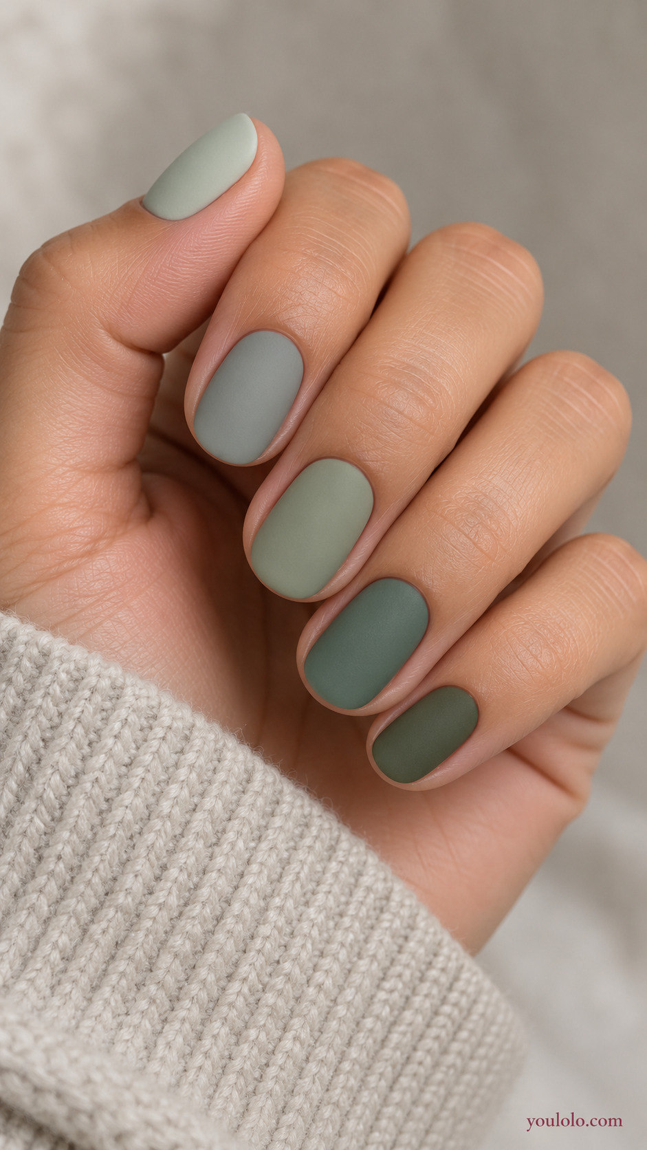 Five Muted Greens in a Tonal Set on a softly gathered feminine hand with a matte green manicure