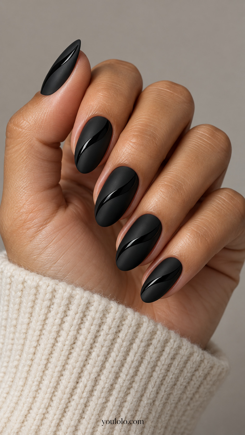 Matte black nails with narrow glossy black waves