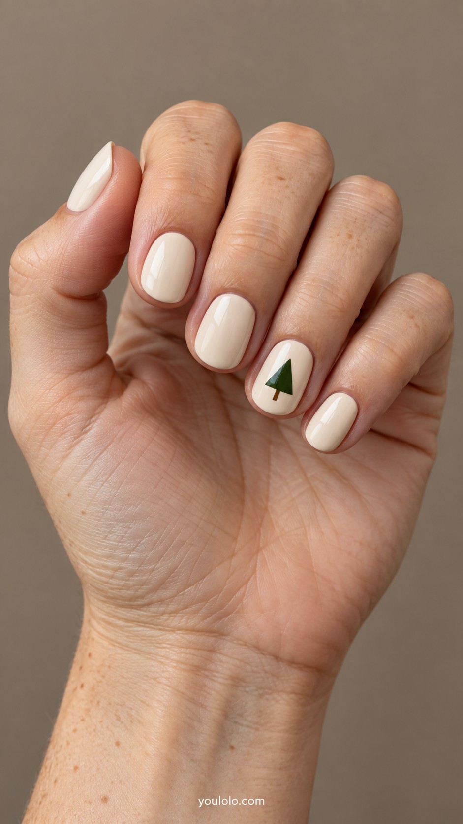 Simple Christmas Nails — Single Green Triangle on Cream