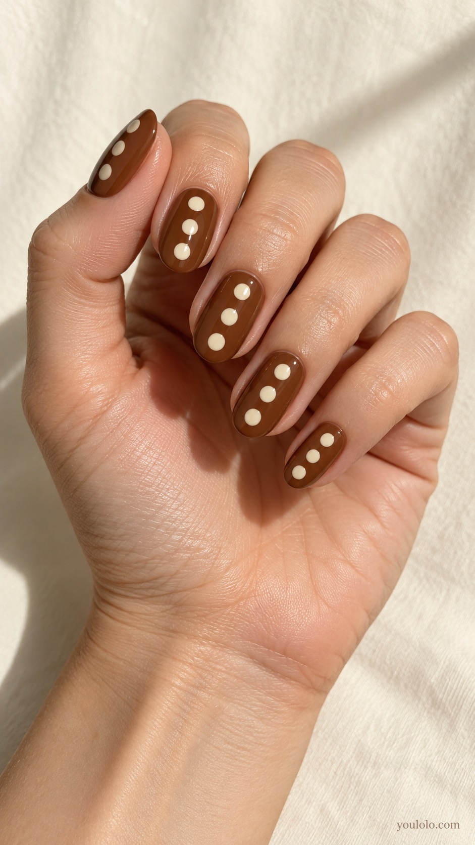 Caramel Oversized Dots — medium oval caramel brown nails three large ivory dots per nail playful clean spacing