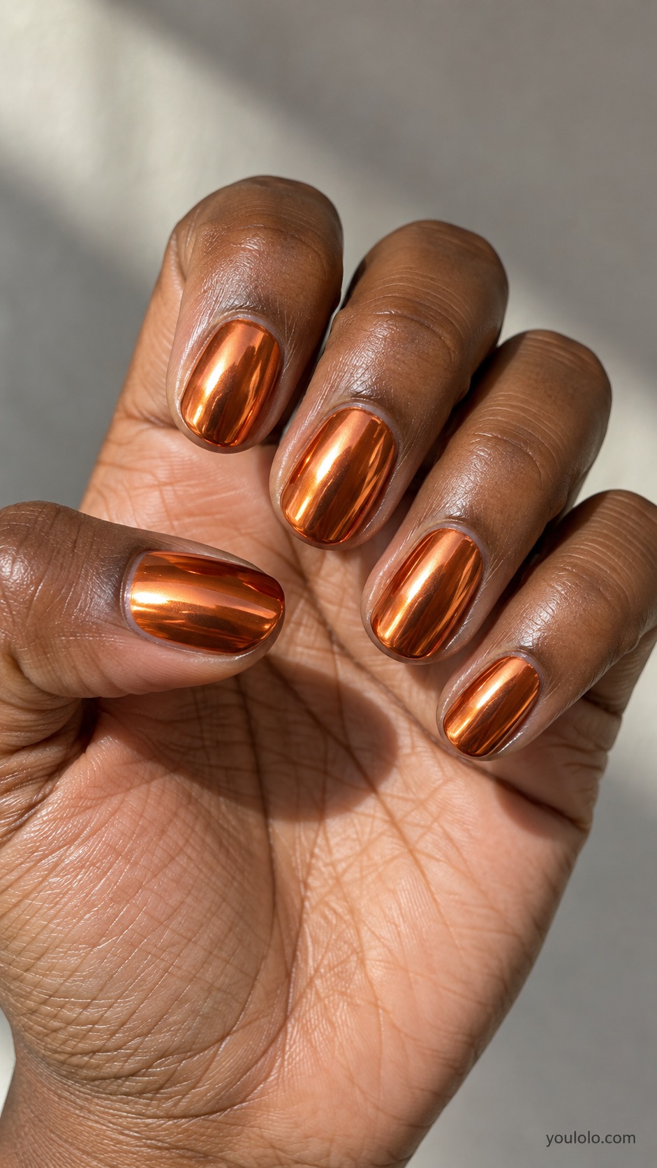 Copper Mirror fall chrome nails — burnished orange copper true metallic mirror chrome on short oval nails, warm copper not yellow gold