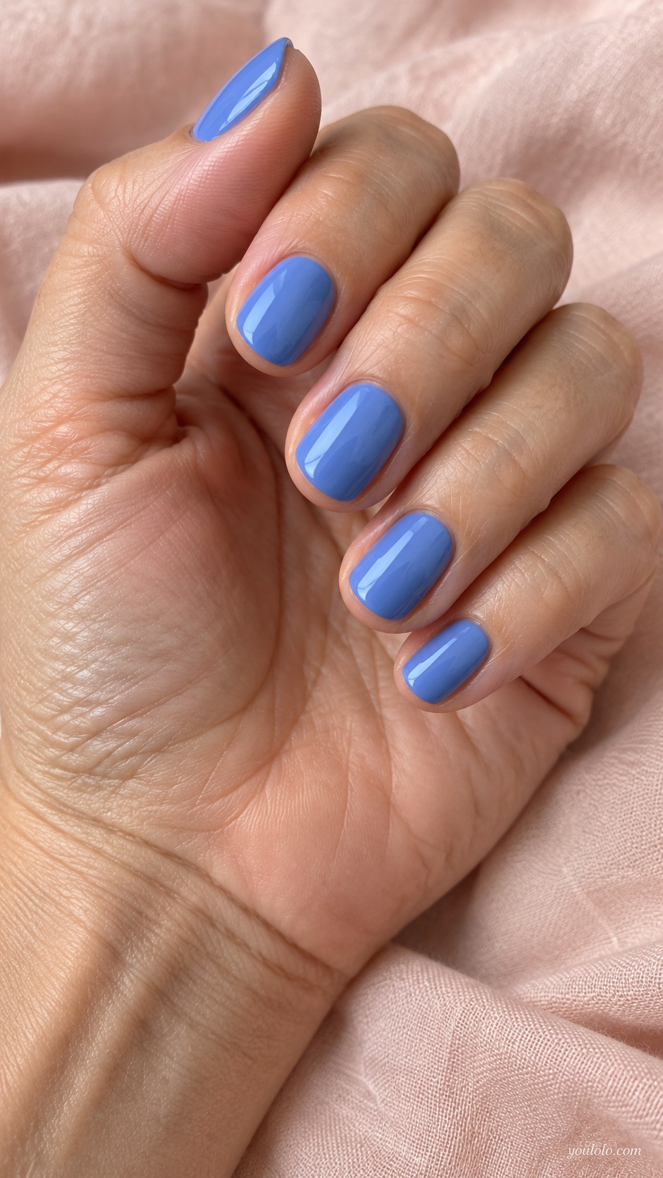 Short oval nails softened cornflower blue opaque cream gloss