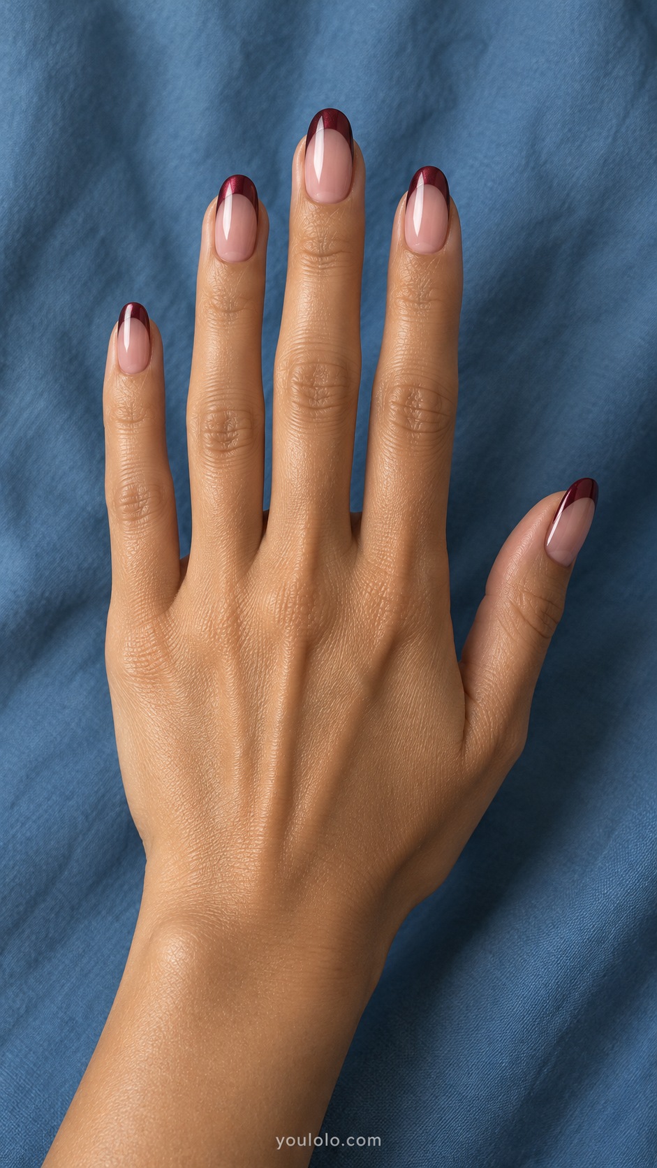 Medium oval sheer rosy neutral base with burgundy pearlescent french tips