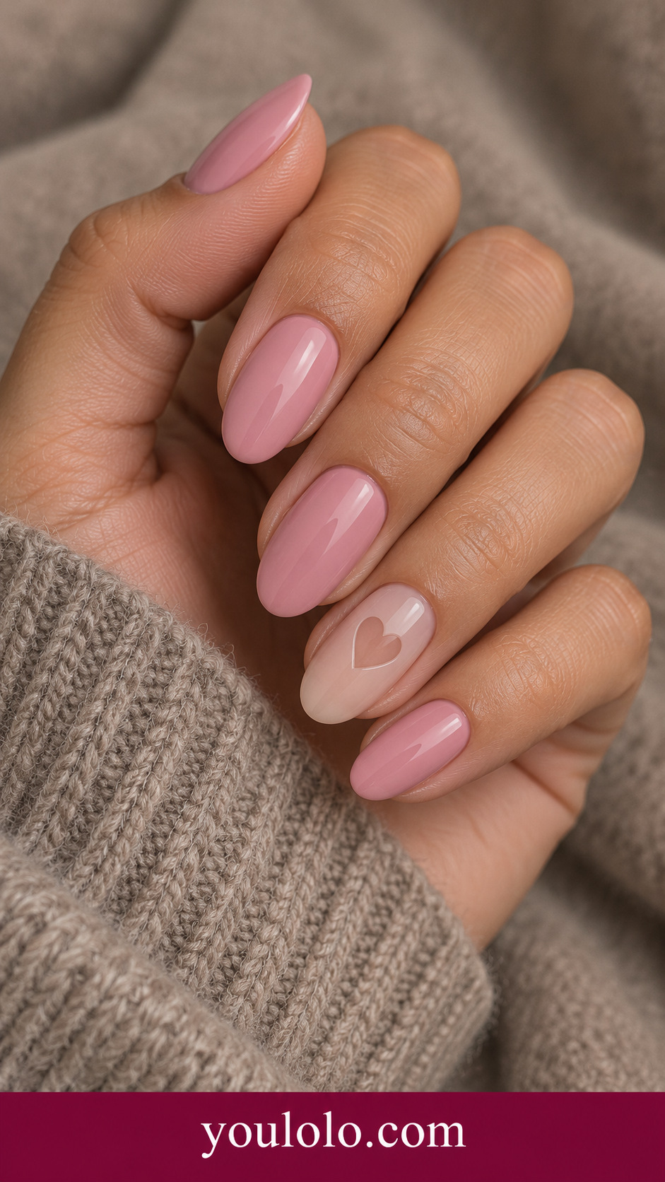 Pink Negative Heart: medium oval dusty pink nails ring nail one sheer nude heart cutout centered on a naturally posed adult hand