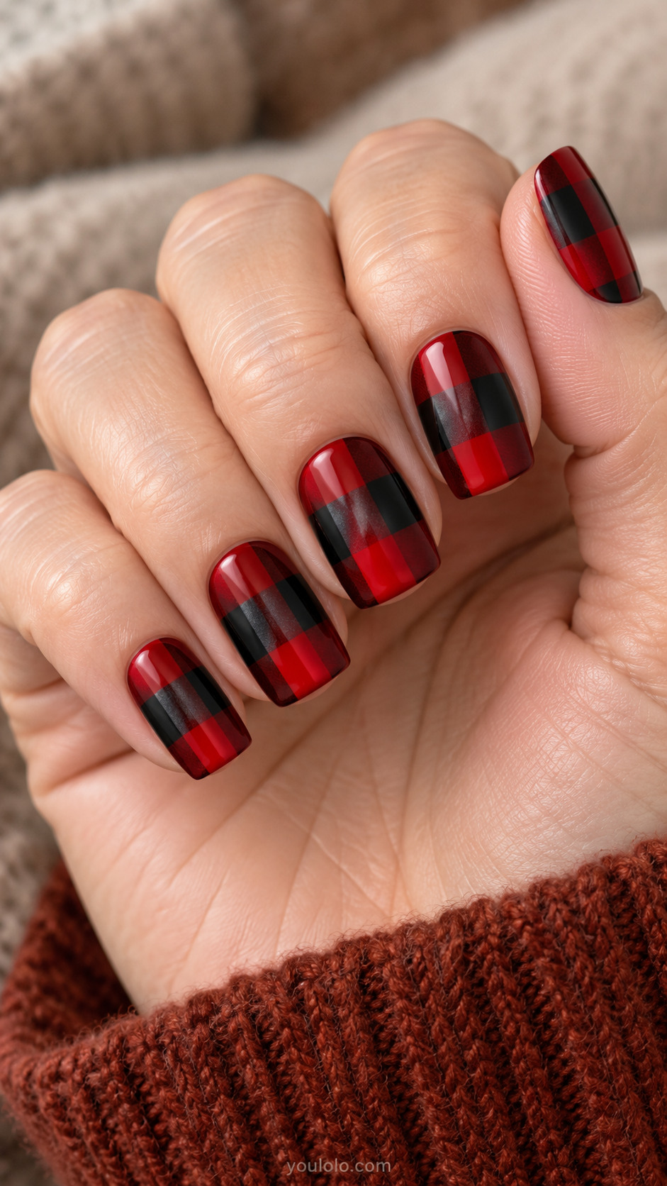 Square nails with oversized glossy red-and-black checks