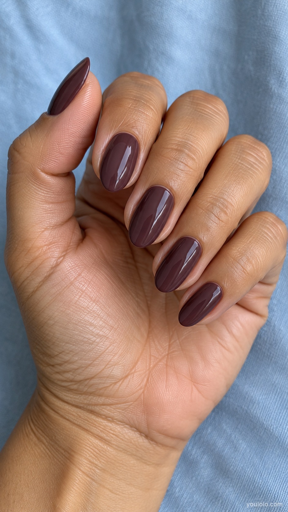 Medium almond nails warm brown leaning fig purple cream gloss