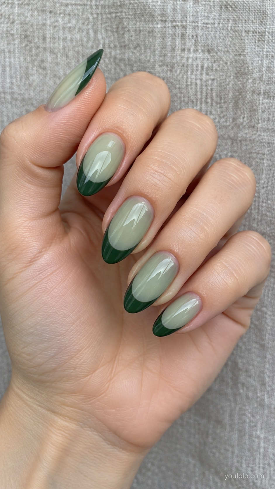 Medium almond nails sheer sea glass pale green base with deep pine green broad side French crescent