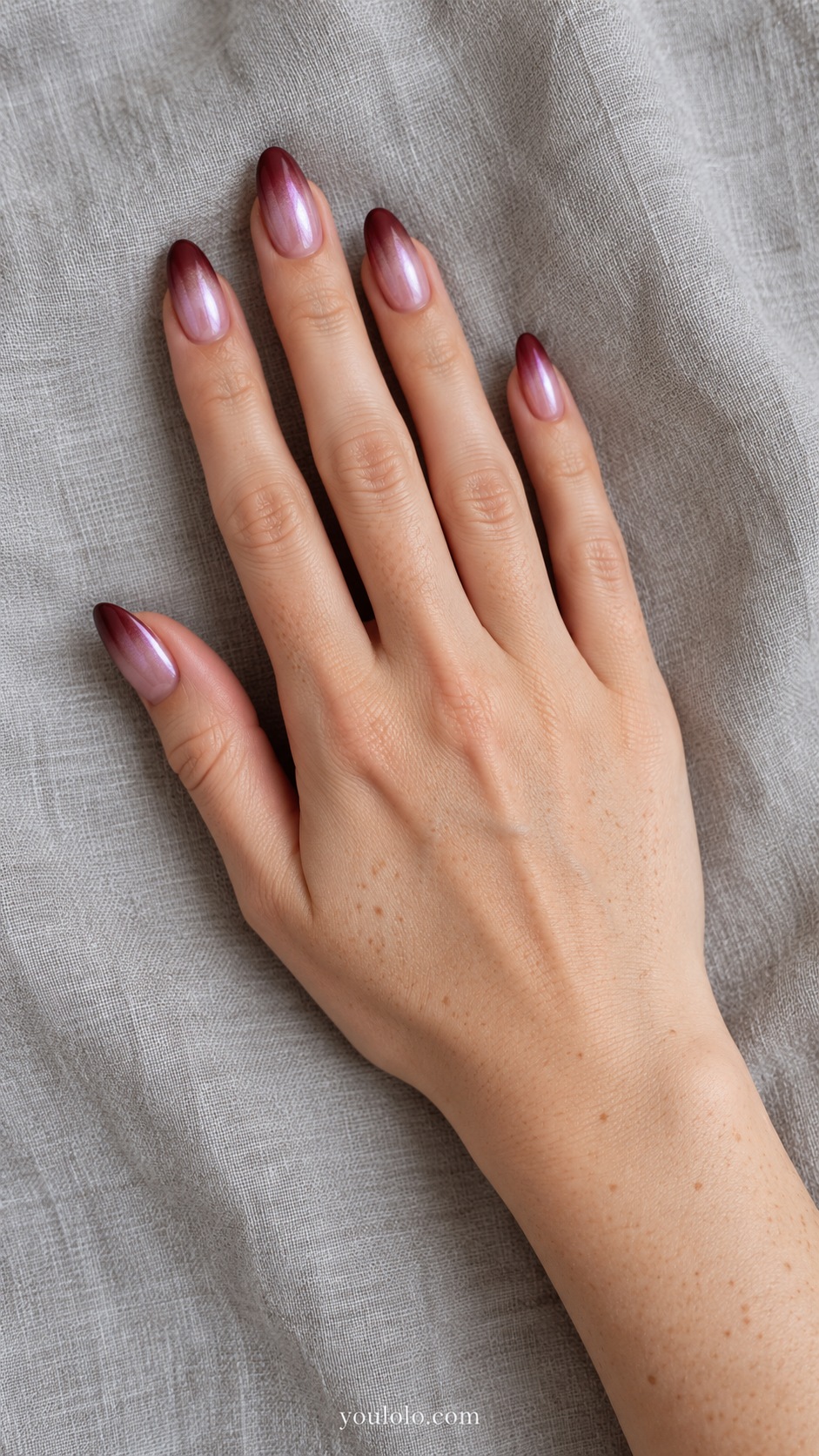Medium almond gradient pale rose cuticle to burgundy tip beneath delicate pearl veil