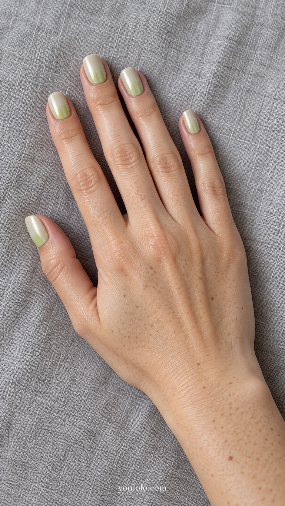 Short squoval green gradient pale pistachio at cuticle to creamy ivory pearl at tip