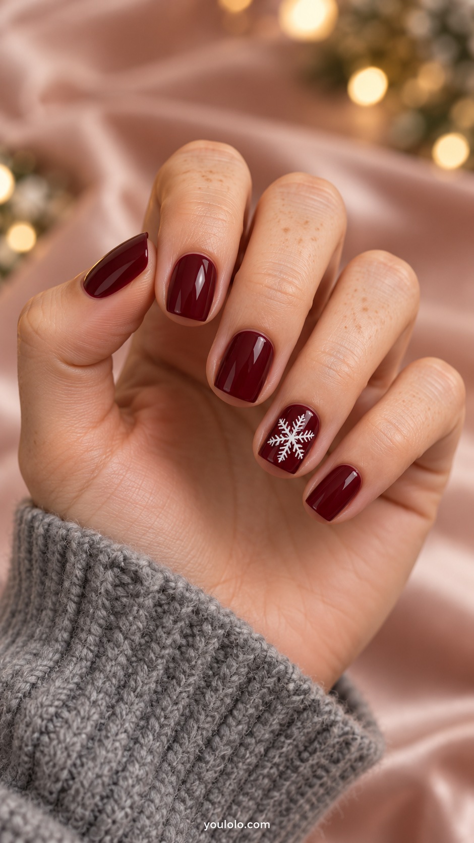 Short square deep burgundy nails one crisp white six branched snowflake on ring nail other nails plain