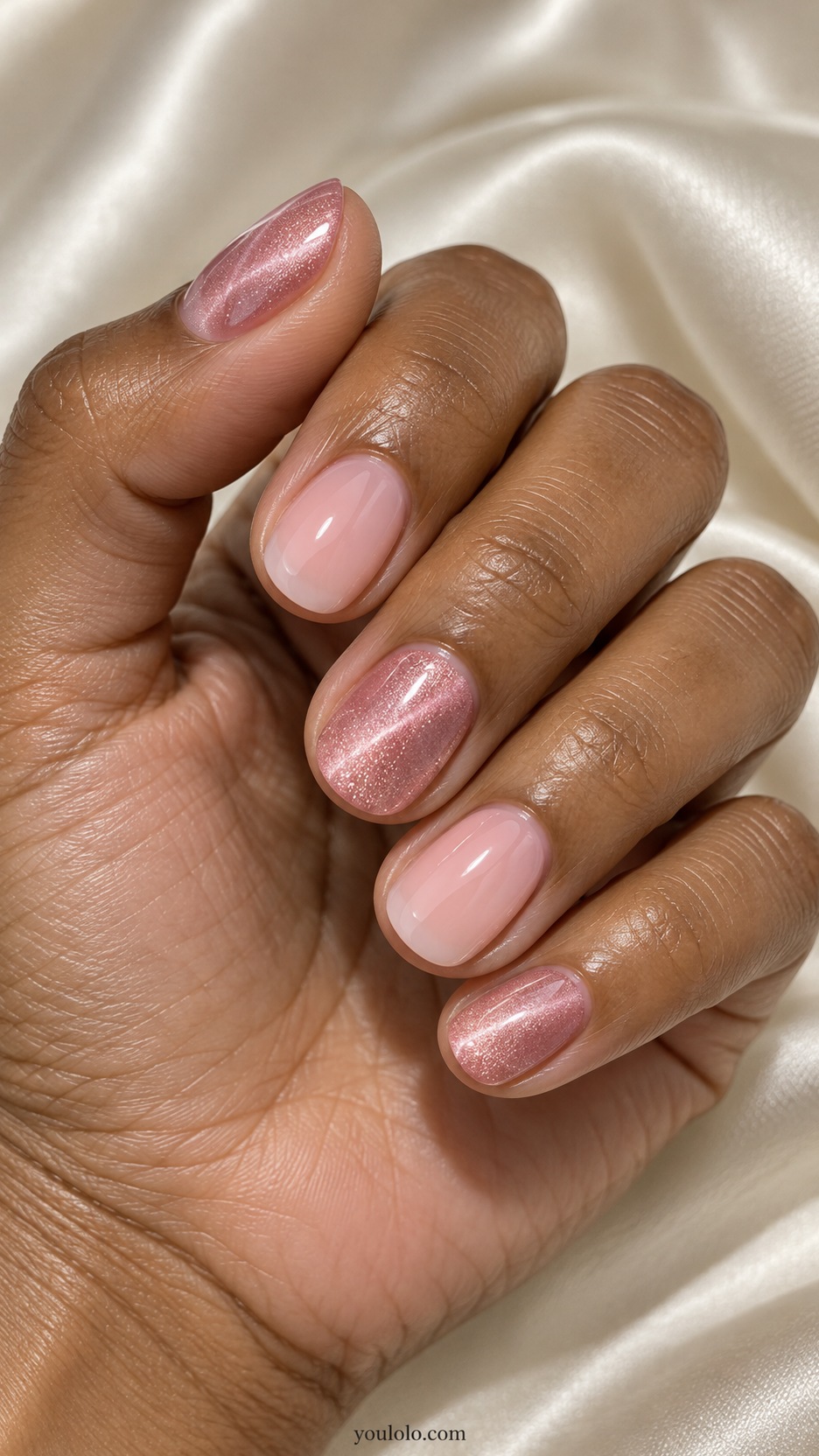 Pink Cat Eye Nails: short rounded nails pink translucent magnetic shimmer on thumb middle little, milky pink smooth index and ring
