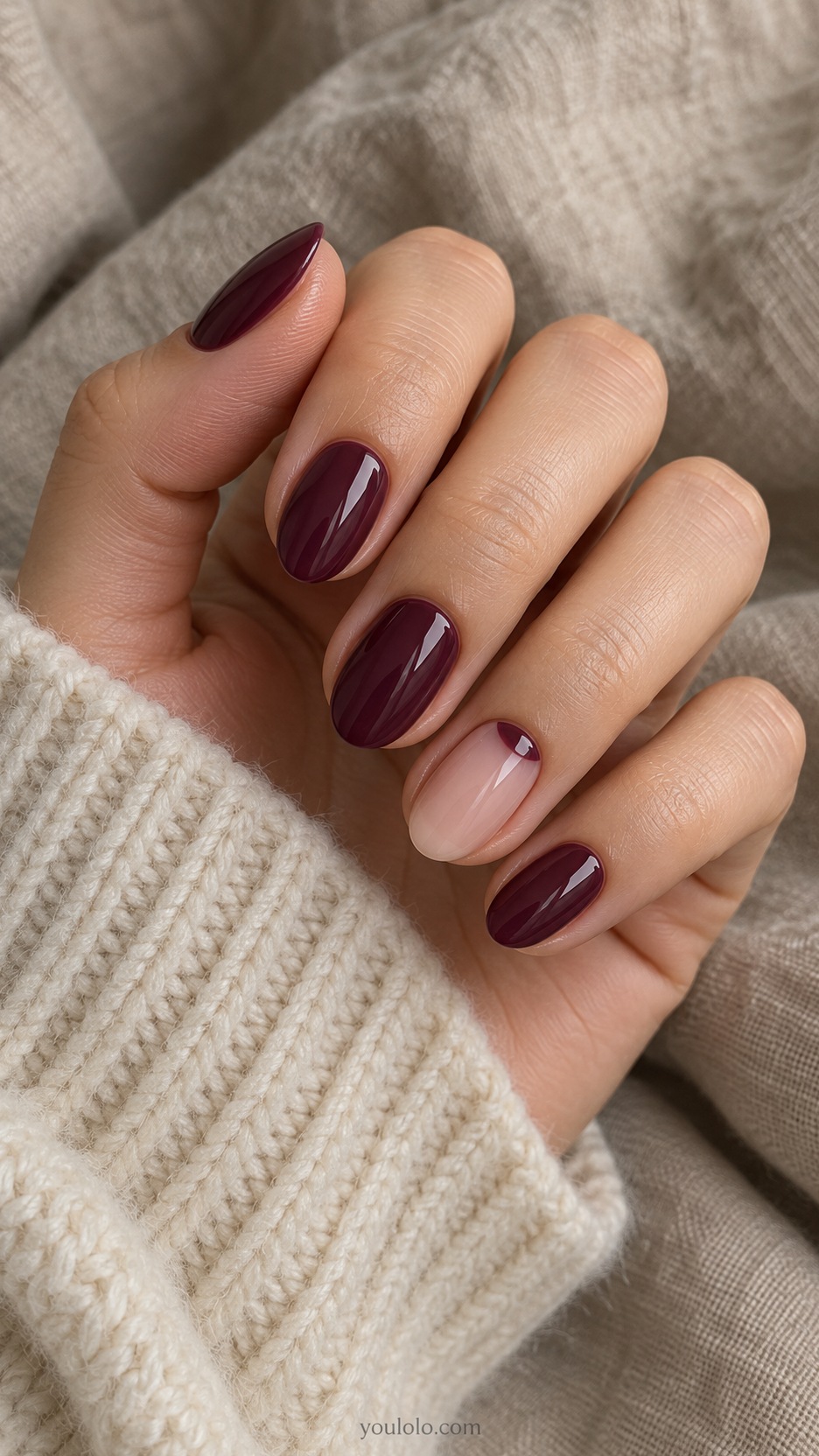 Short Almond Nail Designs: Plum Crescent Accent manicure on a naturally posed hand