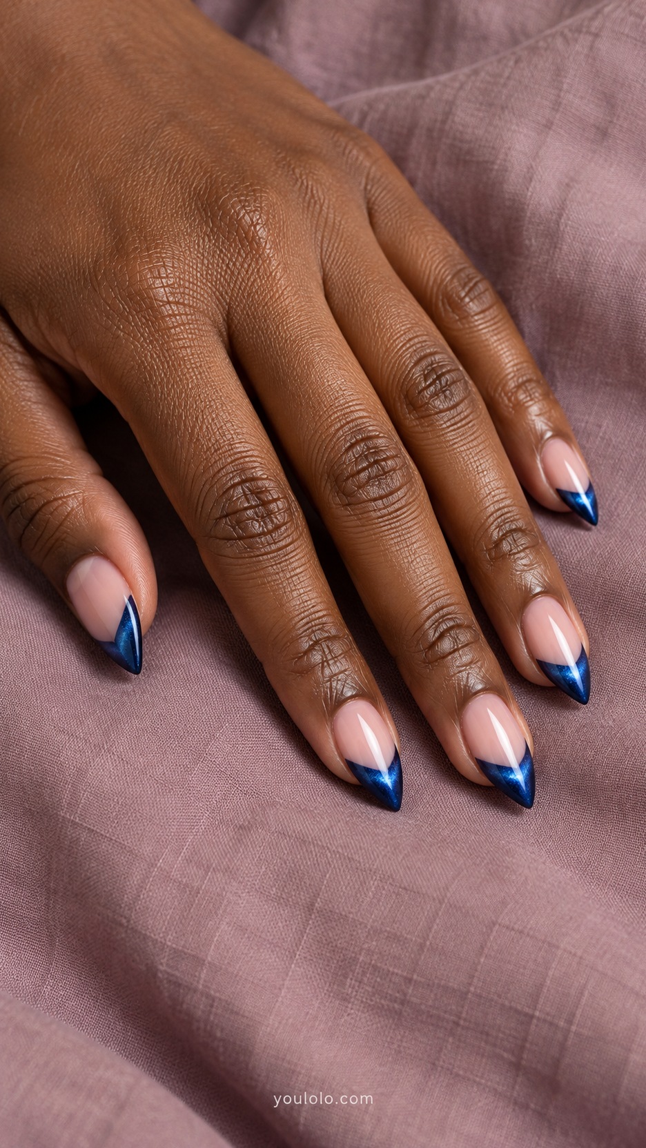 Short Stiletto French Nails: Sapphire Velvet Tips manicure on a naturally posed hand