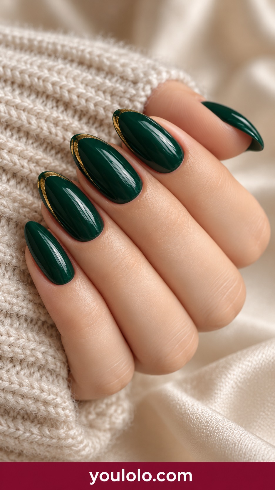 Medium oval deep emerald glossy nails with fine gold crescent near tip on two accents on a naturally curled young adult hand