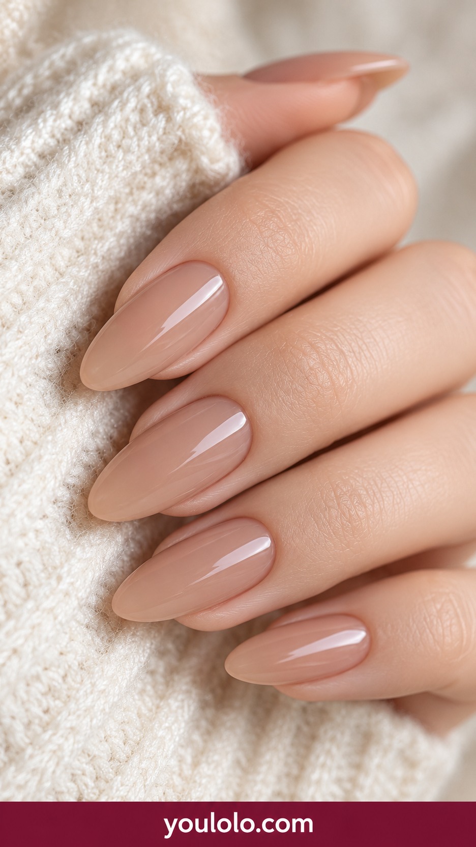 Medium almond sheer neutral beige nails natural glossy no art on a naturally curled young adult hand