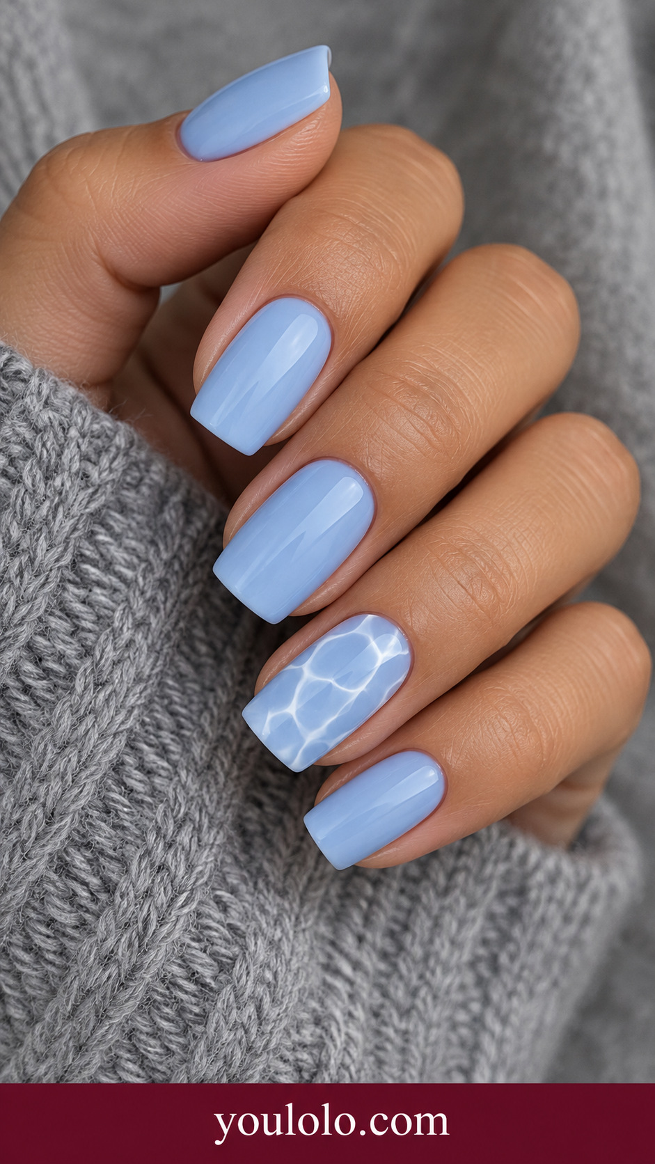 Pool Blue Wavy Grid: medium square pale blue nails ring nail loose white wavy grid with irregular watery cells on a naturally posed adult hand